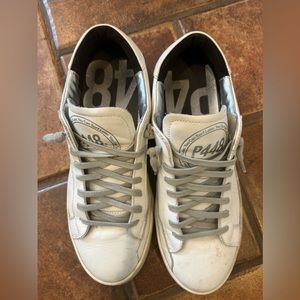 P448 white tennis shoes.